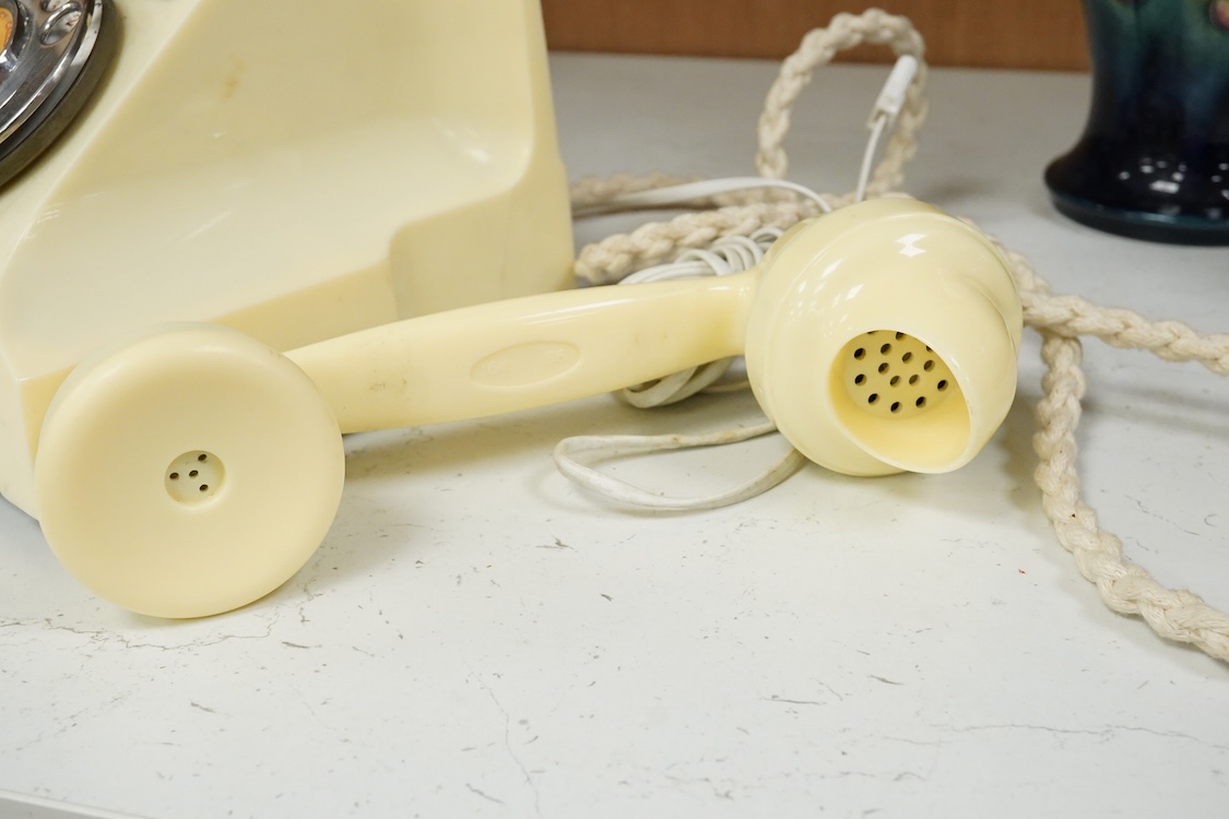 A GPO telephone model 312 in ivory, with a paper centre for a Horsham telephone number, the handset moulded with 164 56 under the grip, with some restoration and adaptations